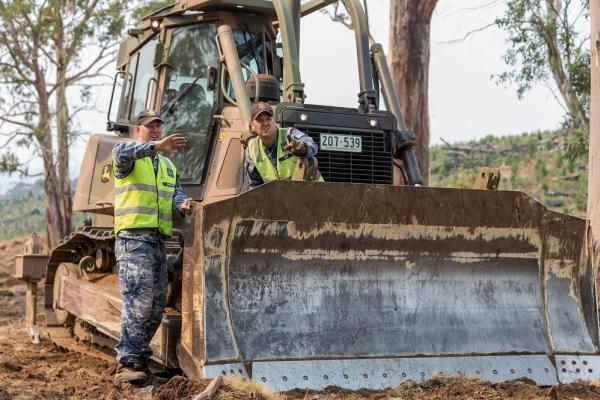 No 65 personnel cutting a fire break in the Bando Forest near Tumut, NSW during Operation Bushfire Assist 2019-2020. Source: Department of Defence