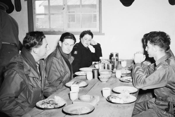 RAAF personnel enjoying a meal while serving in Korea, 1951. Source: AWM, DUKJ3965