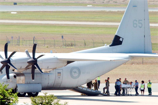 Evacuation of bombing victims into a C-130 Hercules transport aircraft to seek urgent medical treatment