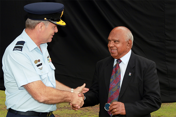 Air Commodore Anthony Grady shaking hands with Harold Allie