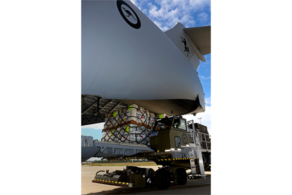 Pallets of Australian Aid (blankets, tarpaulins, hygiene kits and water purification tablets) are loaded onto a No. 36 Squadron C-17A Globemaster aircraft in preparation for delivery to Nepal