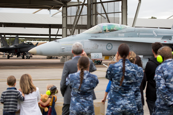 Families and friends gather together on the RAAF Base Williamtown flight line to greet No 77 Squadron personnel returning from Operation OKRA in the Middle East Region.