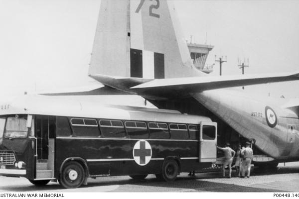 Transit of patients from ambulance bus to a 37 Squadron E- model Hercules from Vung tau, South Vietnam to Richmond Australia for specialist care